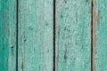 Old and peeling paint Over time, the green paint peeled off from the old boards and the wood texture cracked. Vintage Royalty Free Stock Photo