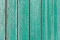 Old and peeling paint Over time, the green paint peeled off from the old boards and the wood texture cracked. Vintage Royalty Free Stock Photo