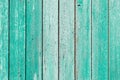 Old and peeling paint Over time, the green paint peeled off from the old boards and the wood texture cracked. Vintage Royalty Free Stock Photo