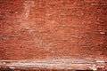 Old peeling paint on a wooden surface. background of retro wall painted in red paint Royalty Free Stock Photo