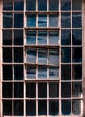 Old factory window texture with sky reflection, London, UK