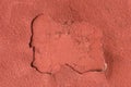 Old peeling red plaster with weathered worn wall texture background Royalty Free Stock Photo