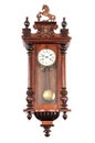 Old pendulum clock on wall