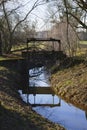 Old penstock, in the public park, with castle Favorite, Foerch Royalty Free Stock Photo