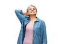 portrait of smiling senior woman in denim shirt