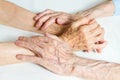 Old people holding hands. Closeup.