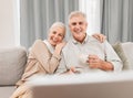 Old people, home and watching tv with coffee and happiness together in retirement with comedy and partner. Love, care Royalty Free Stock Photo