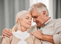 Old people, hug and forehead touch, relax on sofa with love and support, bonding while at home with trust and comfort Royalty Free Stock Photo