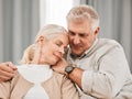 Old people, hug and relax on sofa with love and support, bonding while at home with trust and comfort. Couple with time Royalty Free Stock Photo