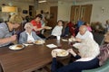 Old people in a nursing home having dinner