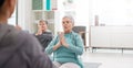 Old people in yoga class, fitness and meditation with breathing, wellness and retirement. Health, exercise and Royalty Free Stock Photo