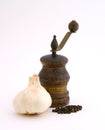 Old pepper mill with garlic Royalty Free Stock Photo