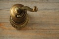 Old pepper mill on wooden background Royalty Free Stock Photo