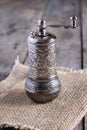 Old pepper mill on wooden table Royalty Free Stock Photo