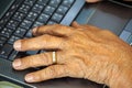 Old person hands typing Royalty Free Stock Photo