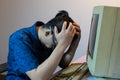 Old personal computer with man very stressed Royalty Free Stock Photo