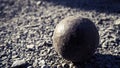 Old petanque balls on the ground. Steel ball on the ground. Light and shadow. Royalty Free Stock Photo