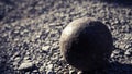 Old petanque balls on the ground. Steel ball on the ground. Light and shadow. Royalty Free Stock Photo