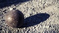 Old petanque balls on the ground. Steel ball on the ground. Light and shadow. Royalty Free Stock Photo