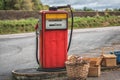 Old petrol station with vintage fuel pump and country side attributes Royalty Free Stock Photo