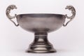 Old pewter bowl, cup on the white background Royalty Free Stock Photo