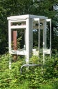 Old phone booth in the French countryside Royalty Free Stock Photo