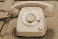 Old phone vintage style on the wooden floor. Royalty Free Stock Photo