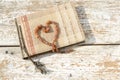 Old photo album with amber necklace heart Royalty Free Stock Photo