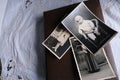 Old photo albums lie on a white mint tablecloth, vintage photographs of 1960, concept of family tree, genealogy, childhood Royalty Free Stock Photo