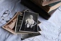 Old photo albums lie on a white mint tablecloth, vintage photographs of 1960, concept of family tree, genealogy, childhood Royalty Free Stock Photo