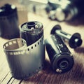 Old photo film rolls, cassette and retro camera. Royalty Free Stock Photo