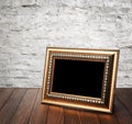 Old photo frame on the wooden table Royalty Free Stock Photo