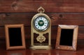 Old photo frames and antique clock Royalty Free Stock Photo