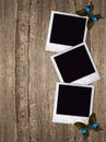 Old photo frames with butterflies over wooden background