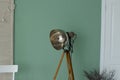 Old photo studio lamp. Old style studio light lamp on wall background Royalty Free Stock Photo