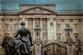 Old photo with view of Buckingham Palace and statue