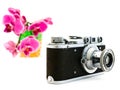 Old photocamera and pink orchid Royalty Free Stock Photo