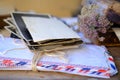 Old photographs, envelopes from letters, wild flowers bouquet on table, home archive documents, concept of family tree, genealogy Royalty Free Stock Photo