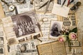 Old photos flowers vintage accessories writing tools flat lay Royalty Free Stock Photo