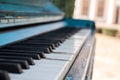 Old piano painted in blue color on the street Royalty Free Stock Photo