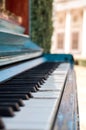 Old piano painted in blue color on the street Royalty Free Stock Photo