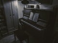 Old piano in the room. Black and white photo of a piano. Royalty Free Stock Photo