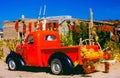 An Old Pick Up Truck Decorated For The Halloween Season With Pumpkins And Other Decorations