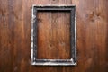 Old picture frame hanging on wooden wall Royalty Free Stock Photo