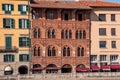 Old picturesque houses at the Arno river waterfront in Pisa Royalty Free Stock Photo