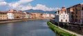 Old picturesque houses at the Arno river waterfront in Pisa, the little church Santa Maria della Spina in the foreground Royalty Free Stock Photo