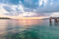 Old pier bridge in beautiful morning sunrise and calmness seascape Royalty Free Stock Photo