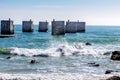 Old pier at Humewood Beach in Port Elizabeth - Waves and ocean at beach Royalty Free Stock Photo