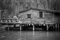 Old pier at lake of Braies in black and white Royalty Free Stock Photo