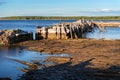 Old pier at low tide Royalty Free Stock Photo